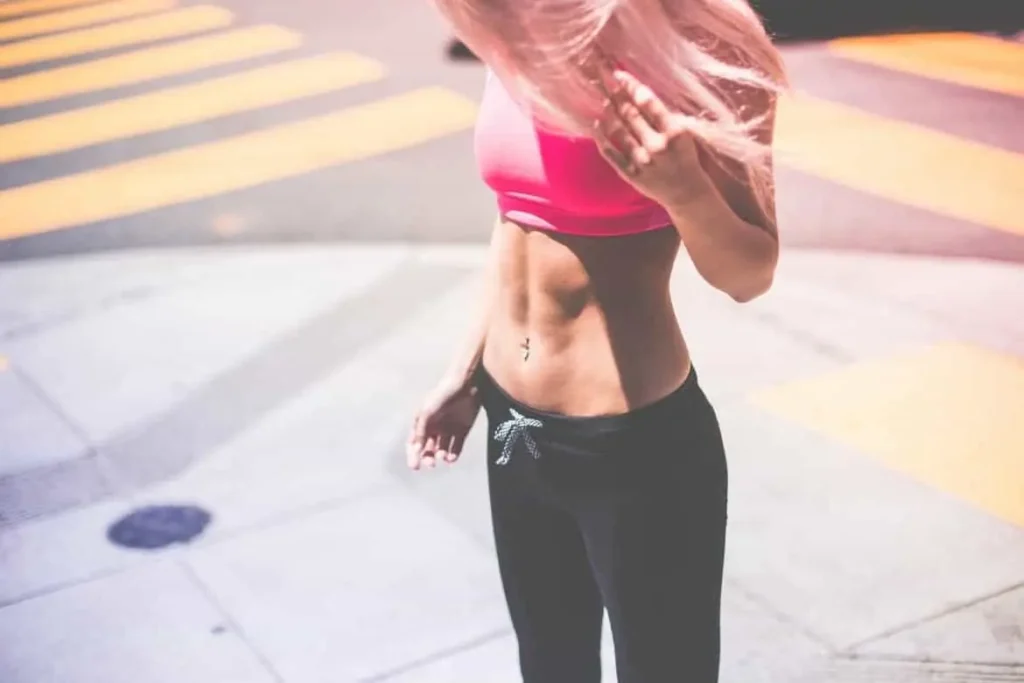 Woman with toned stomach after LA-EMS Body Sculpting Treatment Merthyr Tydfil