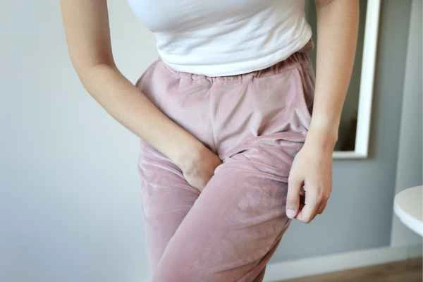 woman running for the toilet because of urinary incontinence Merthyr Tydfil